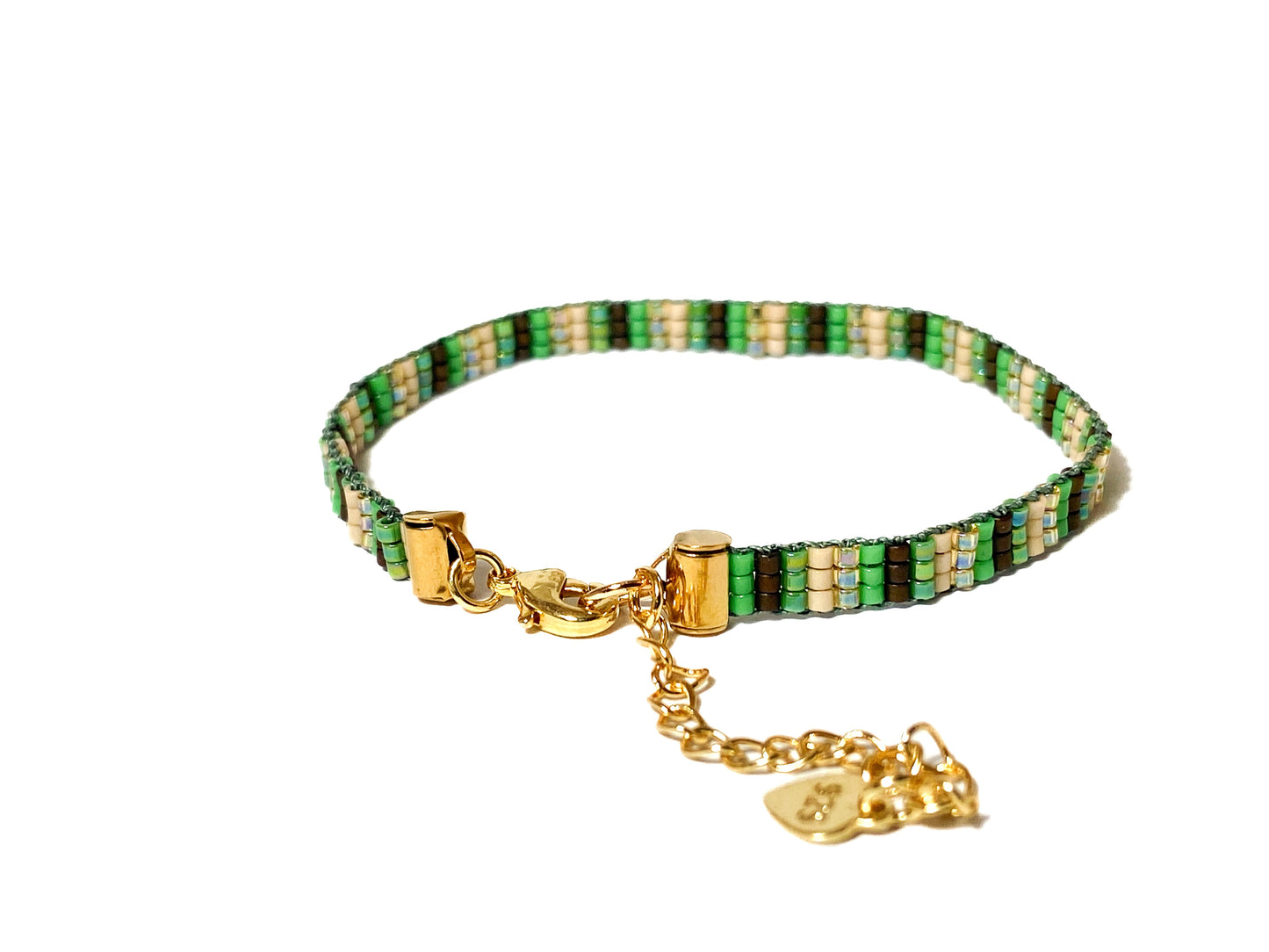 Green and earth-tone handwoven peyote bracelet with Miyuki seed beads, geometric design, and 18k gold-plated brass clasp, adjustable size.