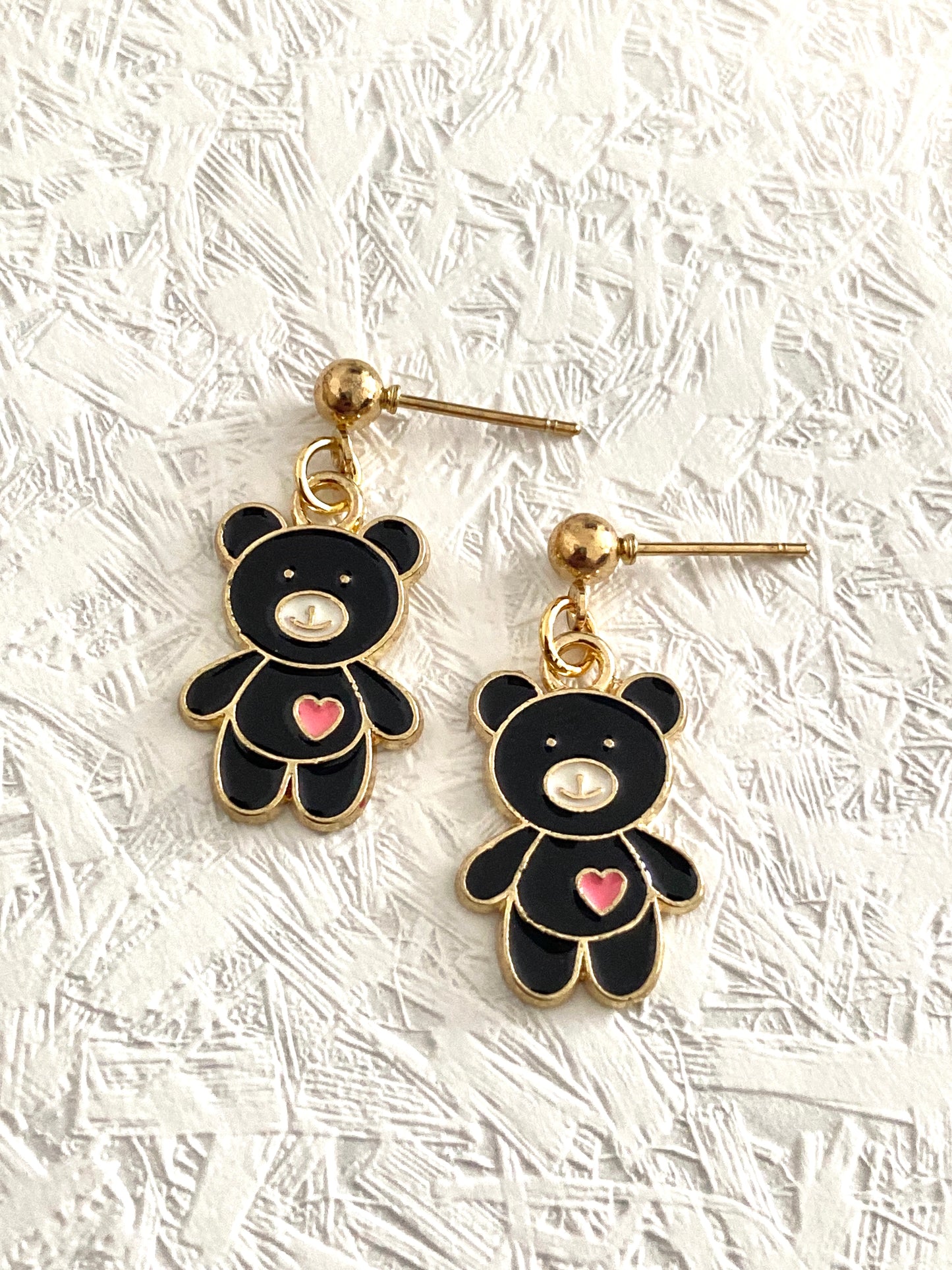 Drop earrings with meadow animal charms.